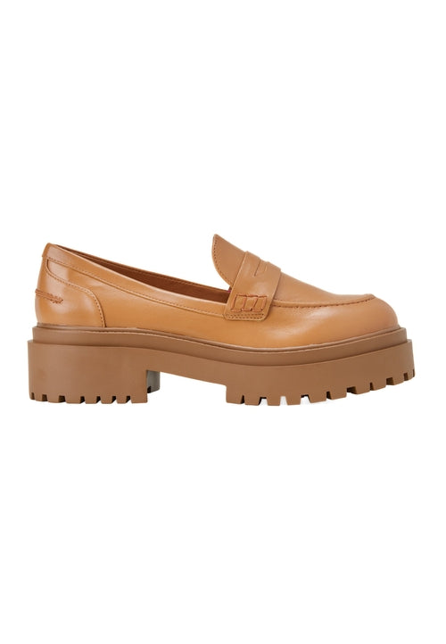 Tan platform loafer shoe on a white background