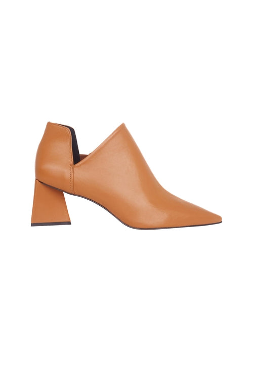 Tan leather shoe with a block heel on a white background