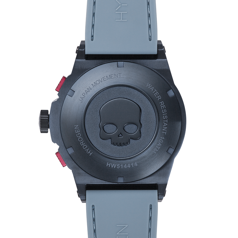 Wristwatch with skull design on the back, gray strap, and visible brand name.