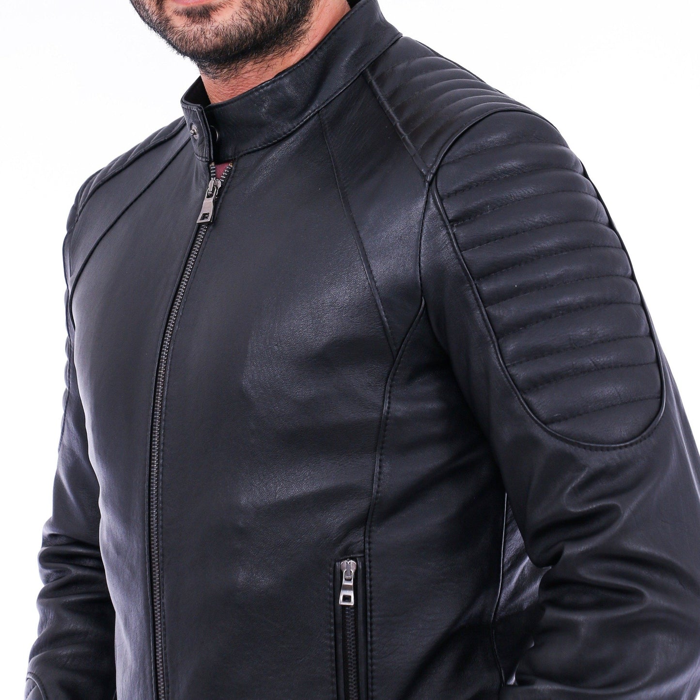 Black leather jacket worn by a person on a white background
