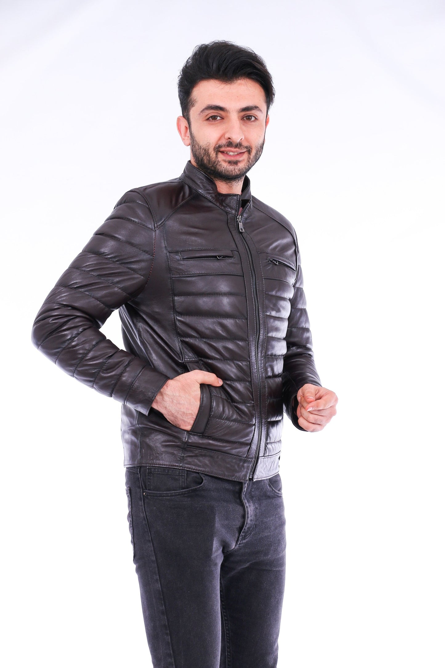 Man wearing a dark leather jacket on a white background
