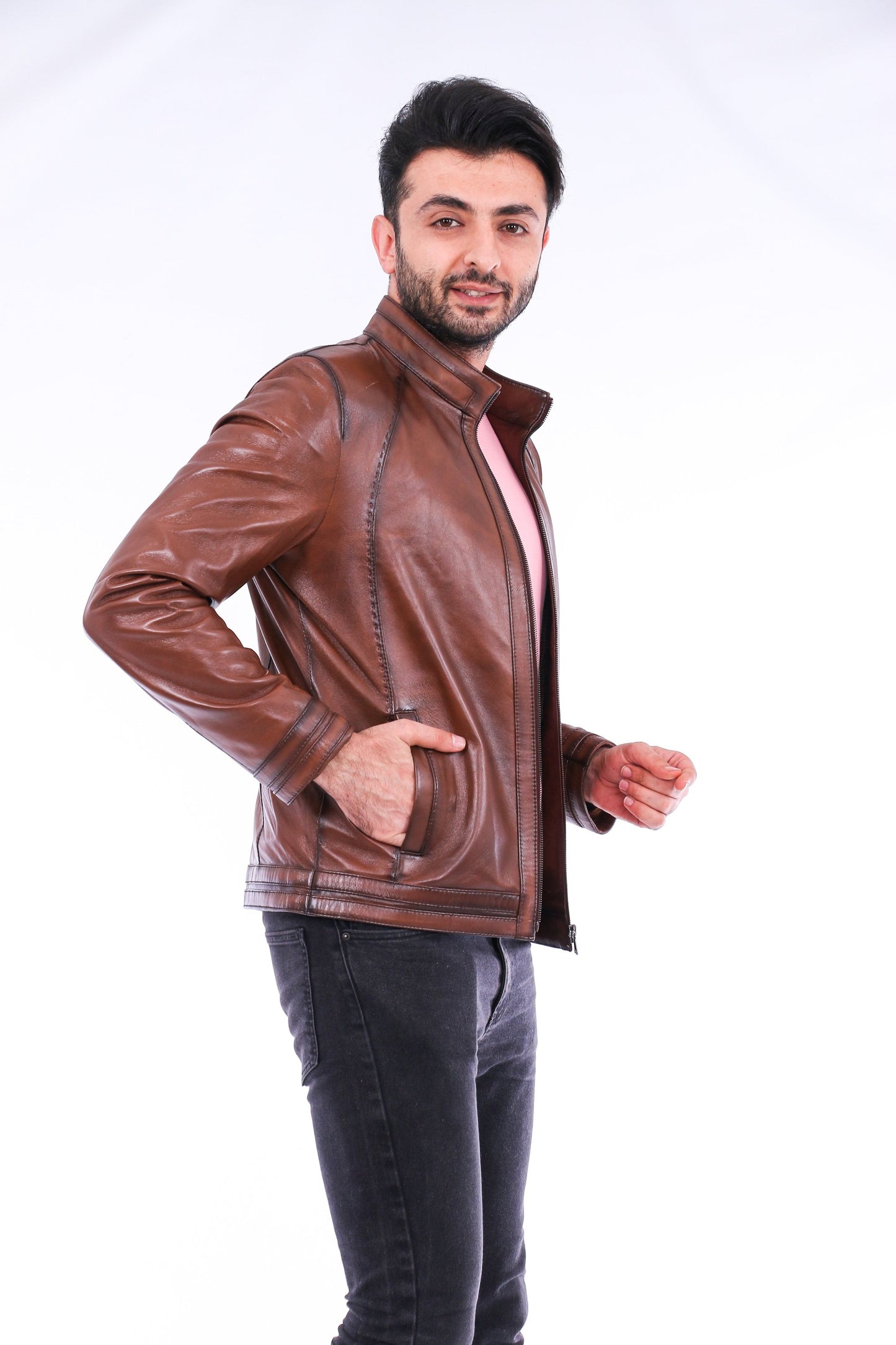 Man wearing a brown leather jacket on a white background