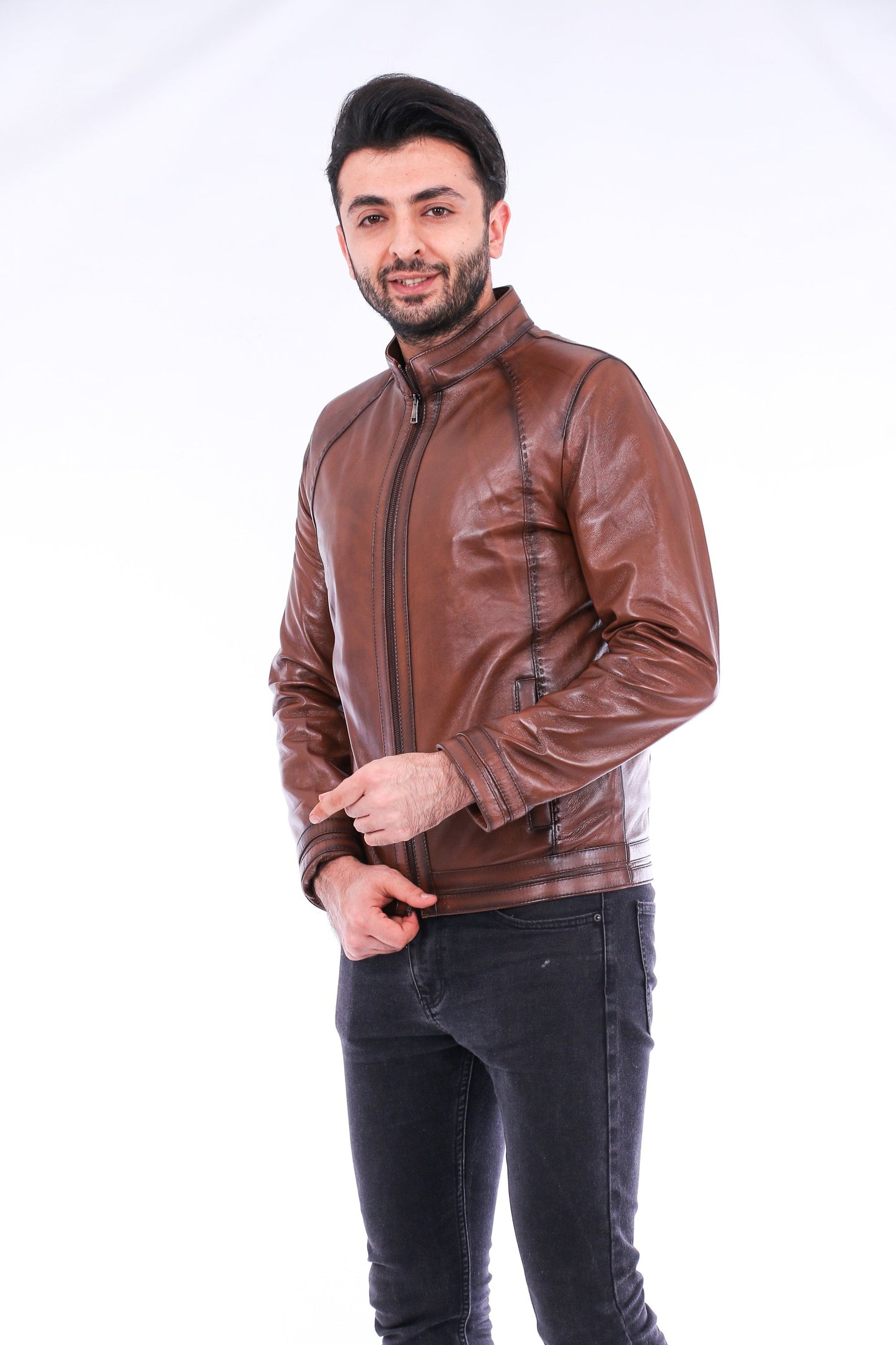 Man wearing a brown leather jacket on a white background