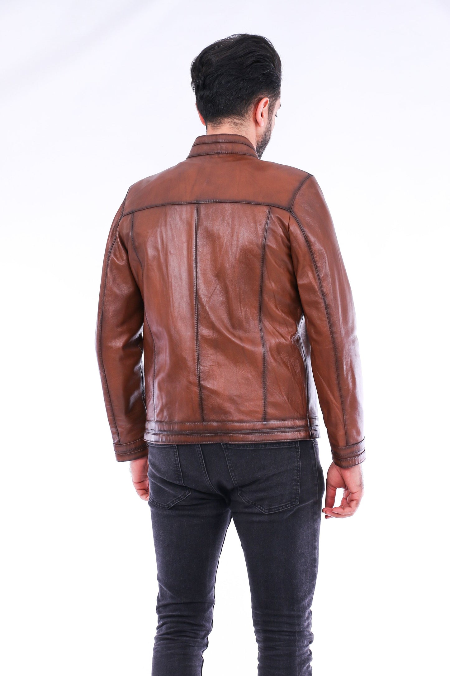 Man wearing a brown leather jacket on a white background