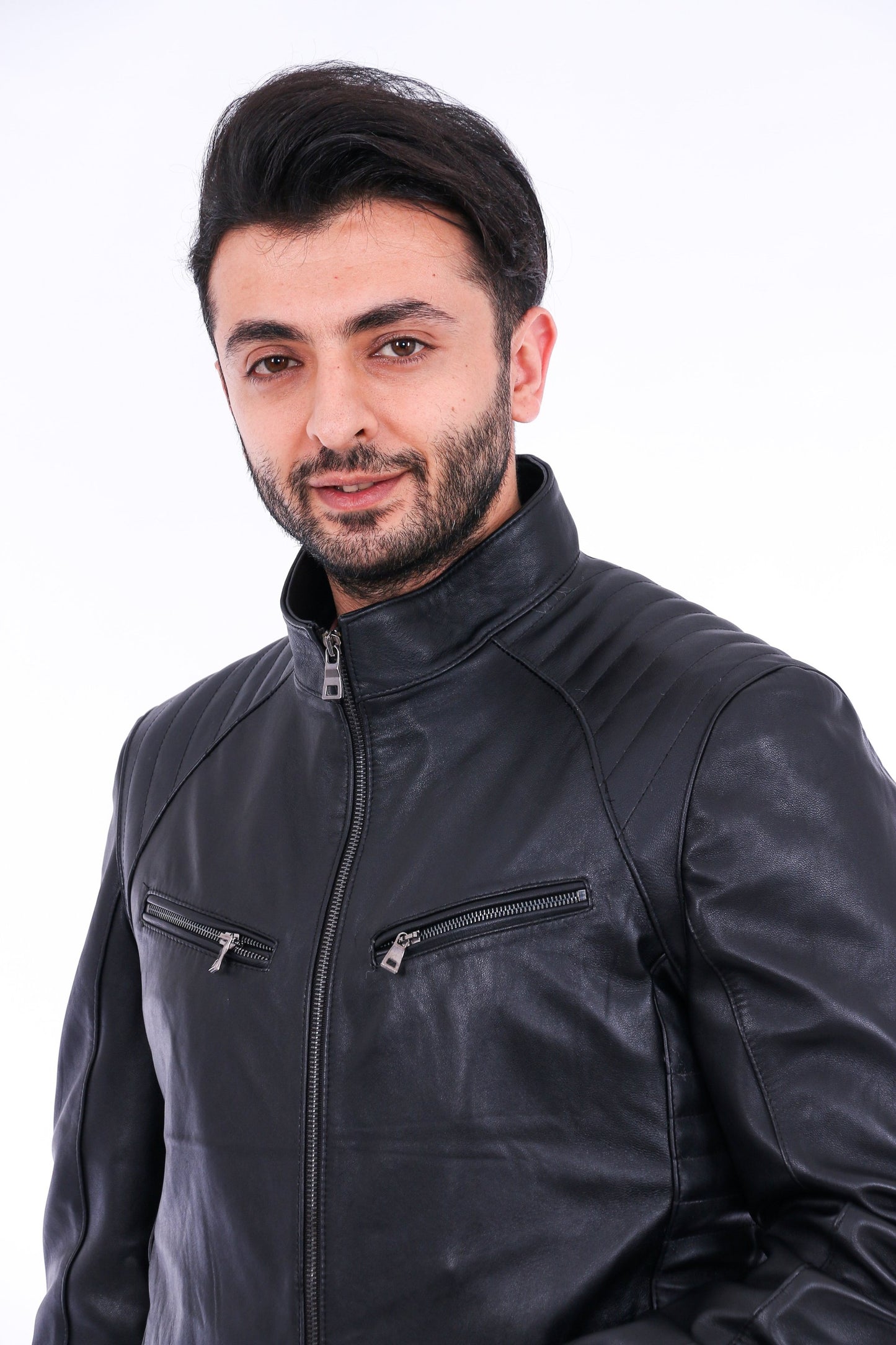 Man wearing a black leather jacket on a white background