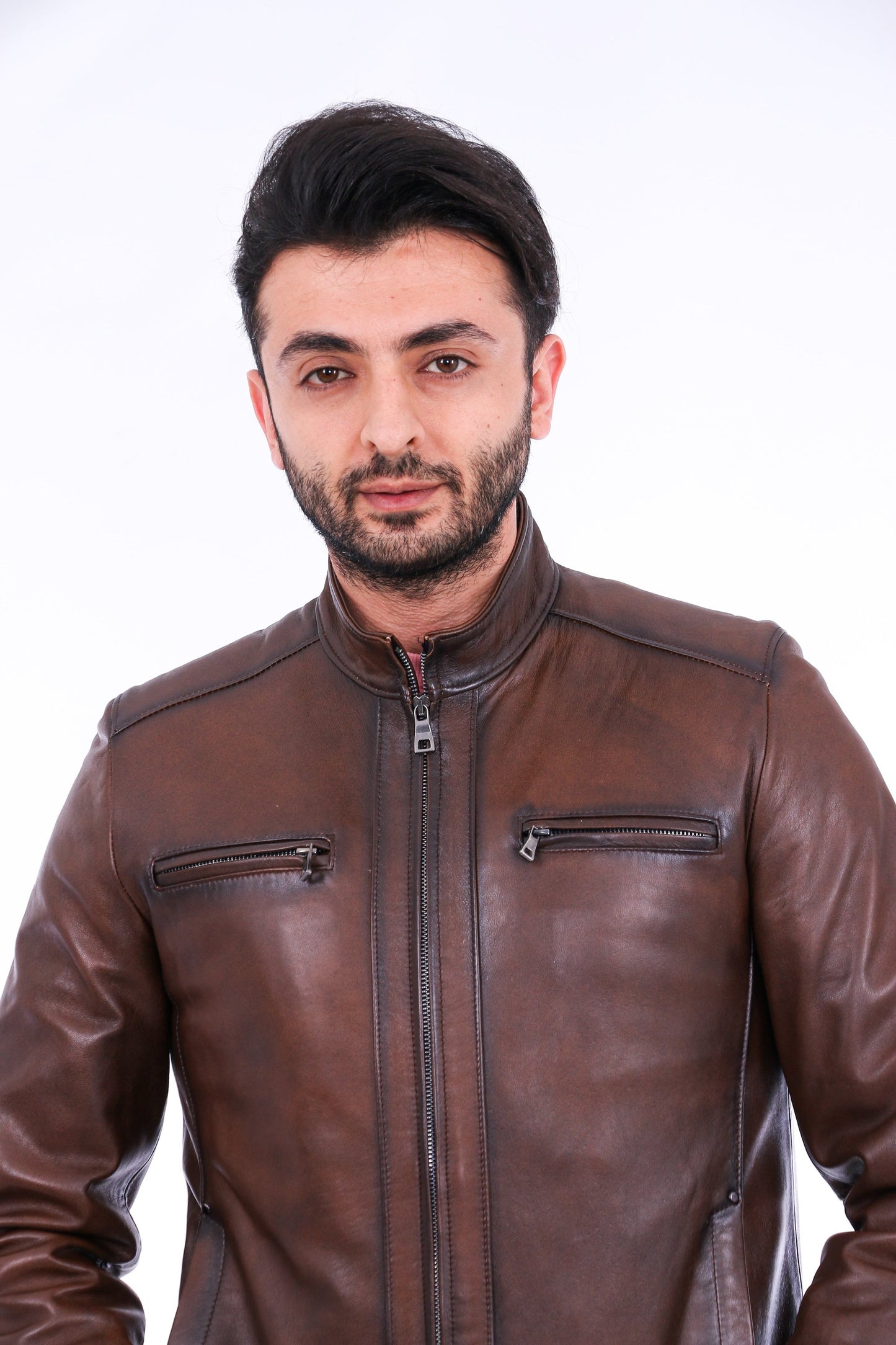 Man wearing a brown leather jacket on a white background