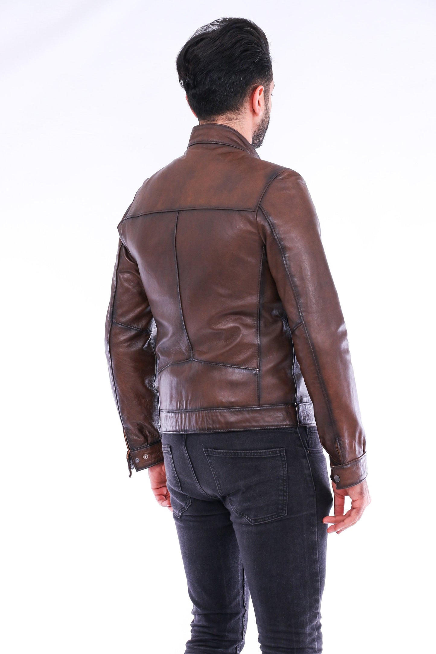 Man wearing a brown leather jacket on a white background