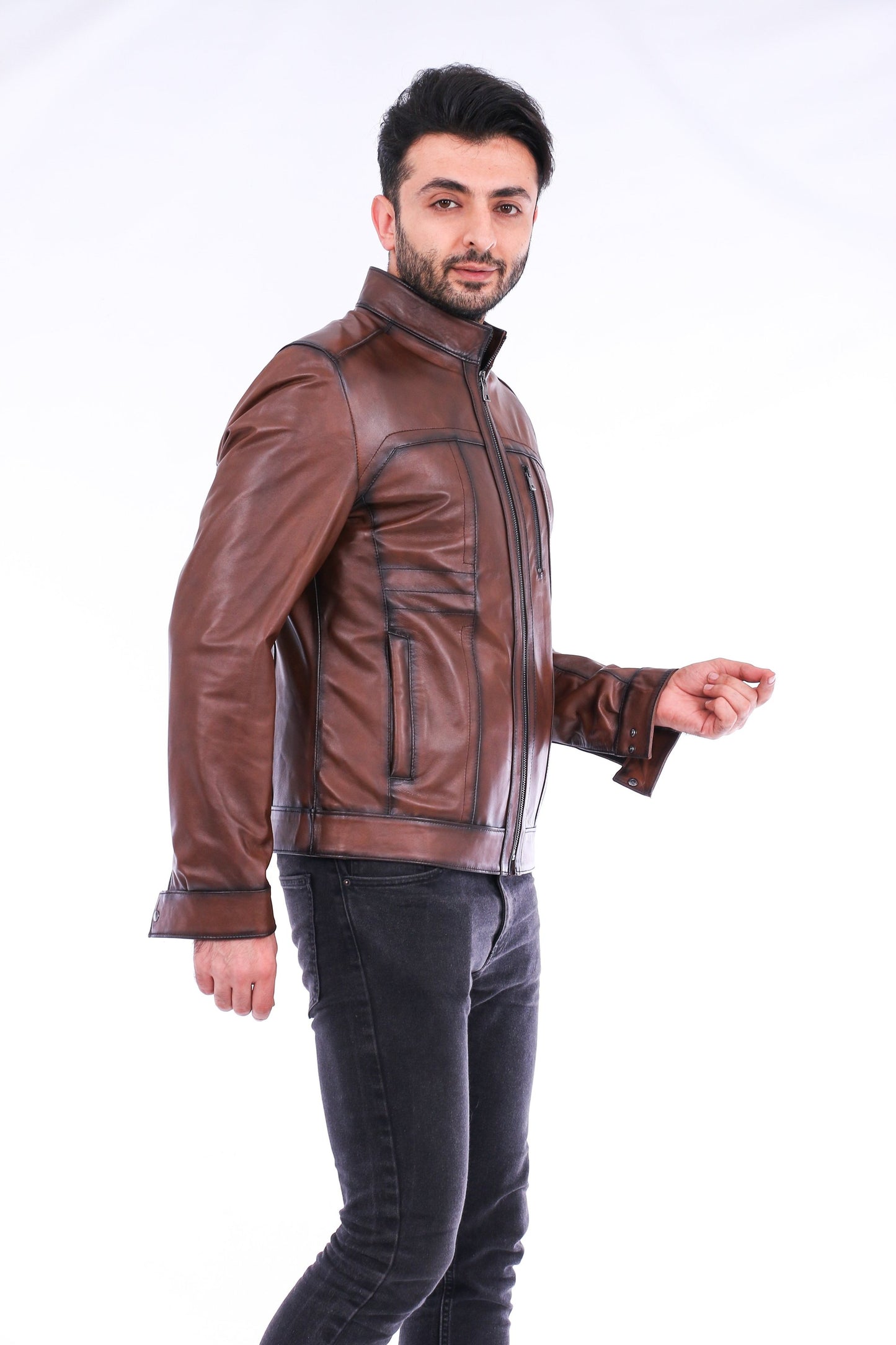 Man wearing a brown leather jacket on a white background