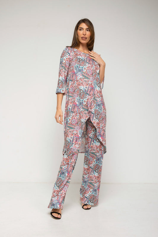 Woman wearing a floral print outfit on a white background