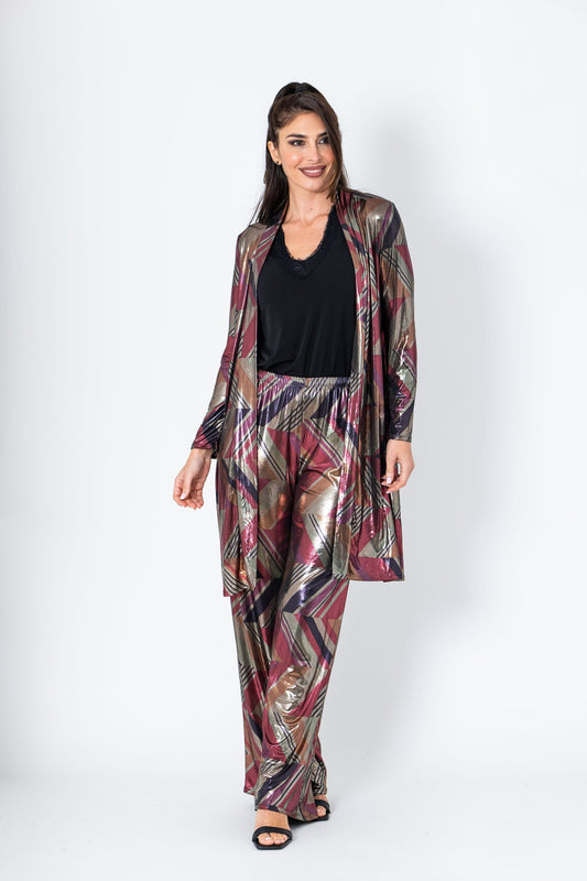 Woman wearing a patterned outfit on a white background