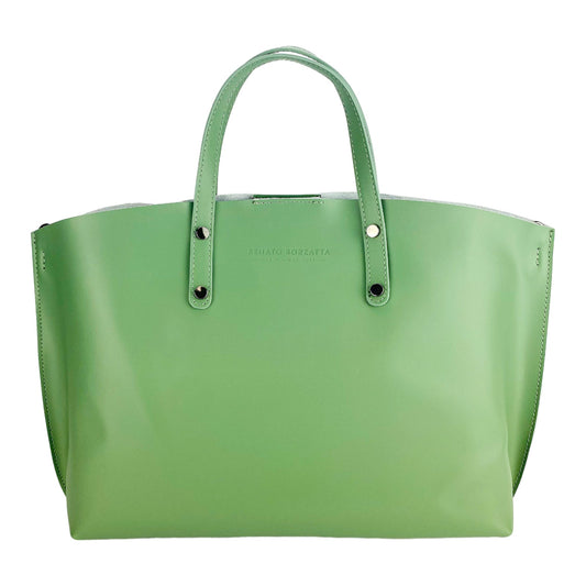 Green handbag with a visible brand name on a white background