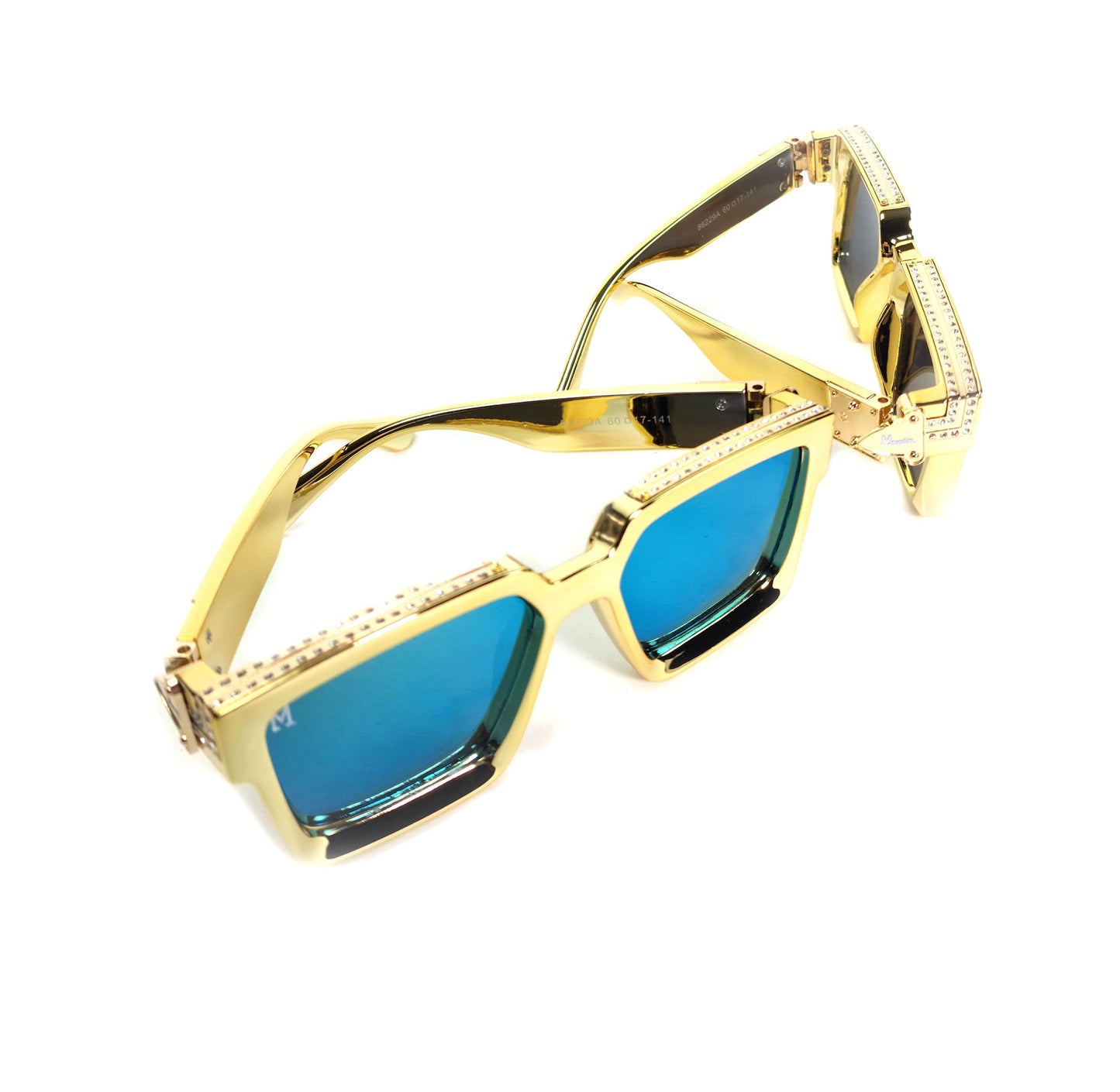 Gold-framed sunglasses with blue lenses on a white background
