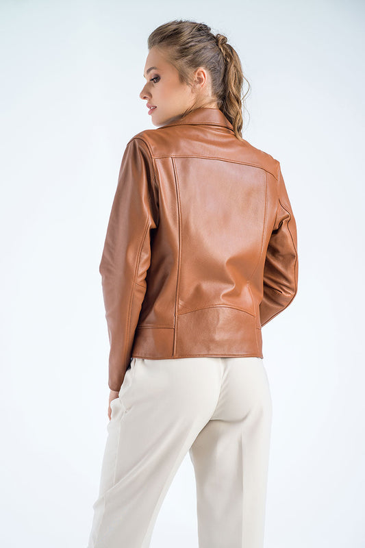 Woman wearing a brown leather jacket on a white background