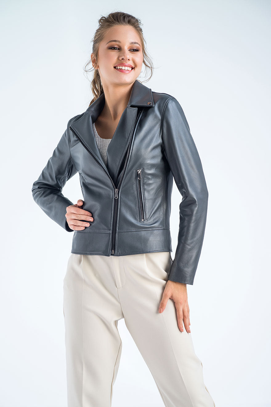 Woman wearing a gray leather jacket on a white background