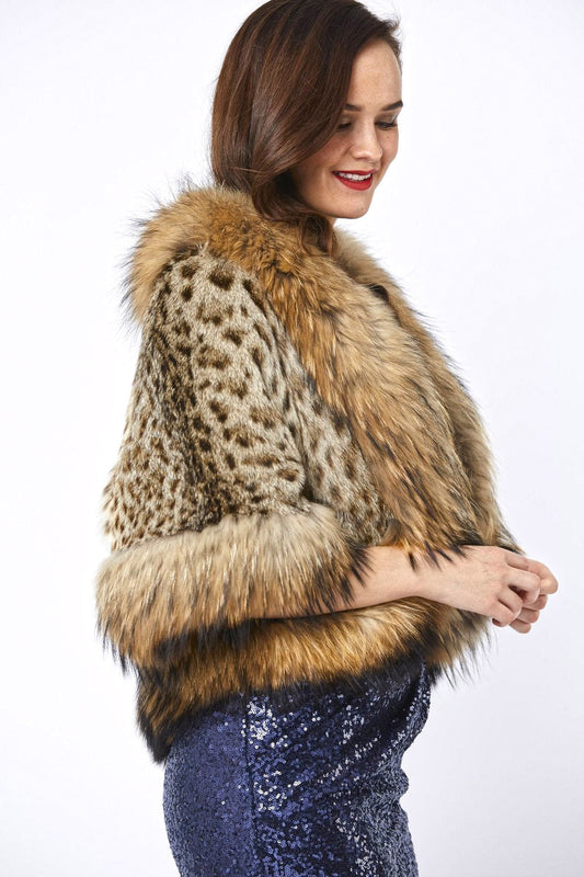 Woman wearing a leopard print fur vest with a white background