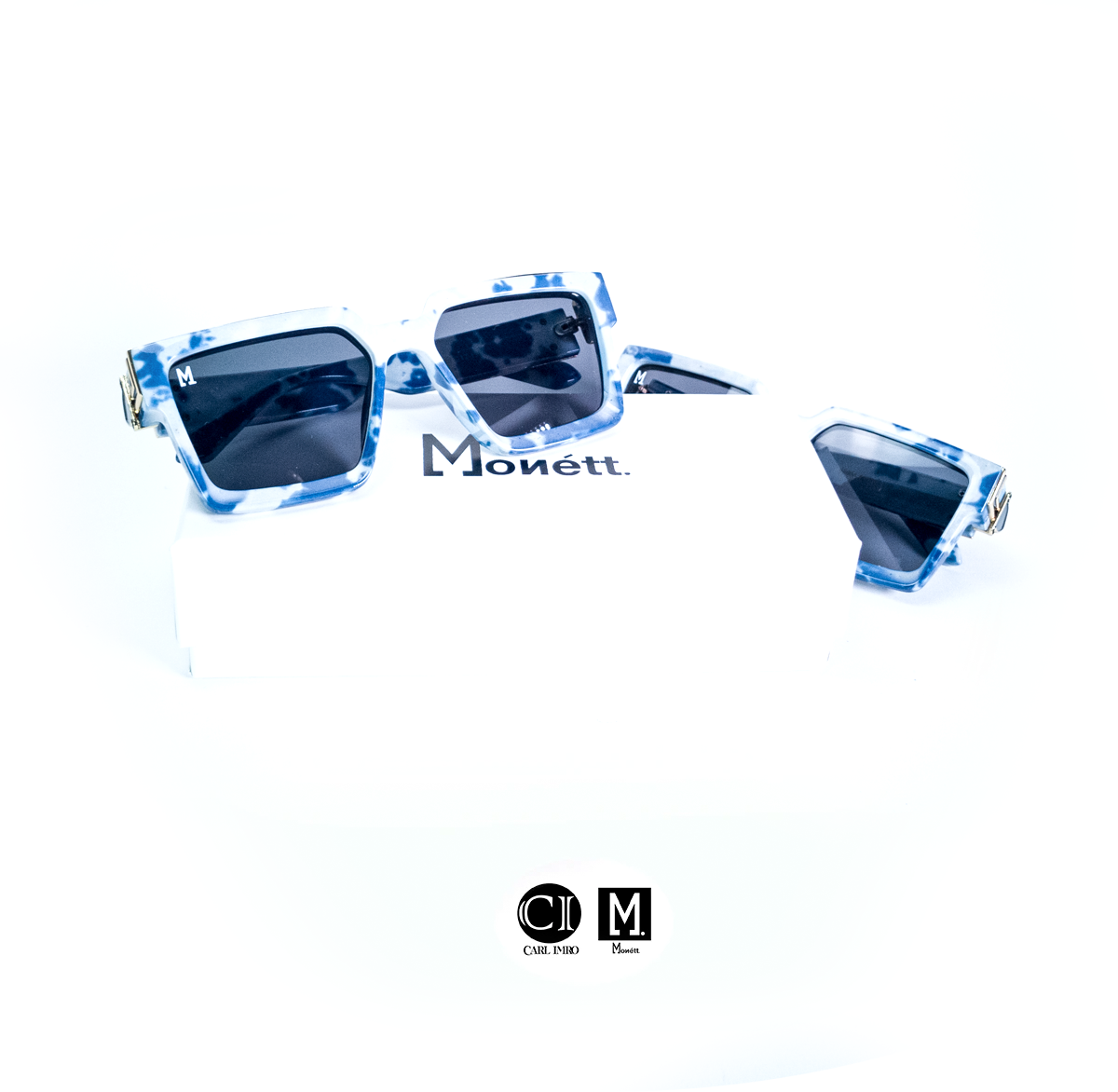 Blue sunglasses with 'Monett' branding on a white background
