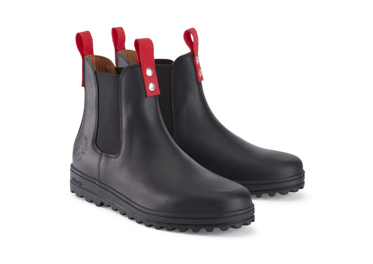 Black rain boots with red straps on a white background