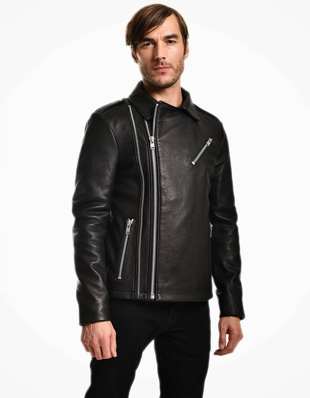 Man wearing a black leather jacket with zippers on a white background