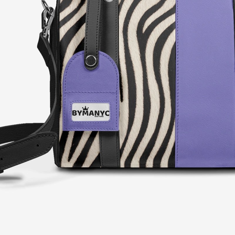 Purple bag with zebra pattern and ByManyC tag on a white background