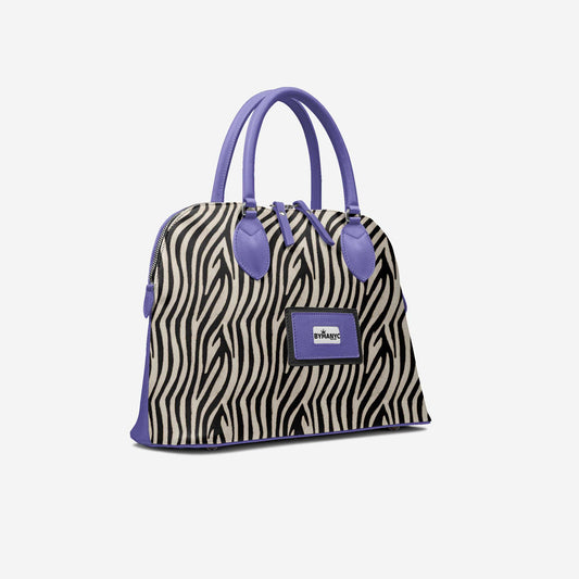 Zebra print handbag with purple accents on a white background