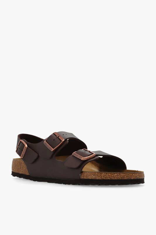 Brown sandal with cork sole on a white background