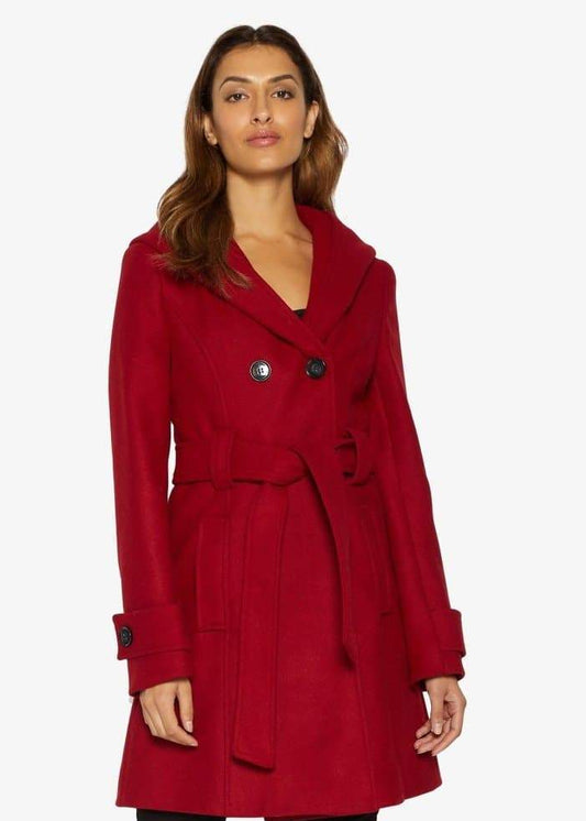 Woman wearing a red coat on a white background