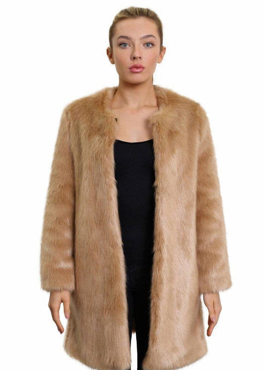 Woman wearing a long fur coat on a white background