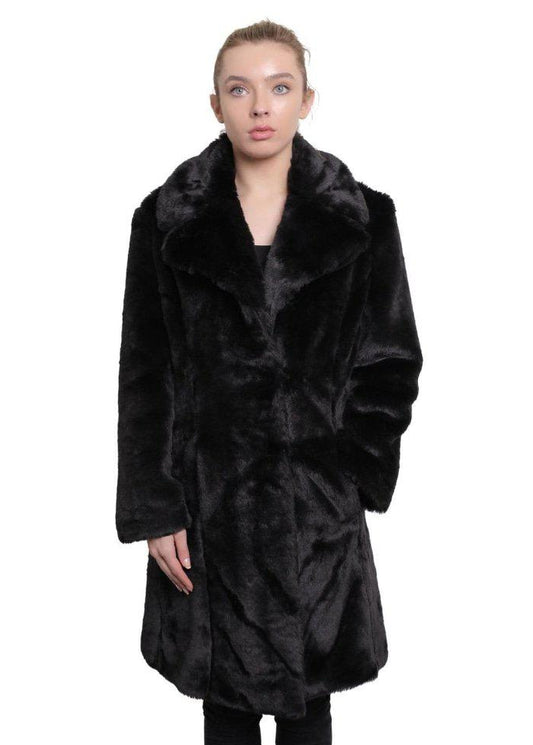 Woman wearing a black fur coat on a white background