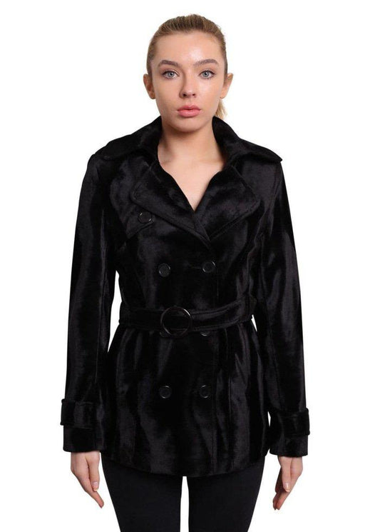 Woman wearing a black coat on a white background