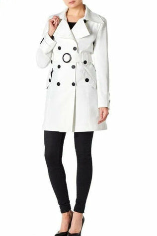 White coat with black polka dot pattern worn by a model on a white background