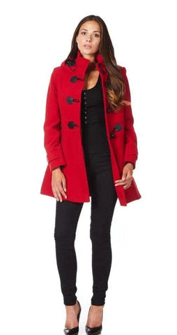 Woman wearing a red coat with black buttons on a white background.
