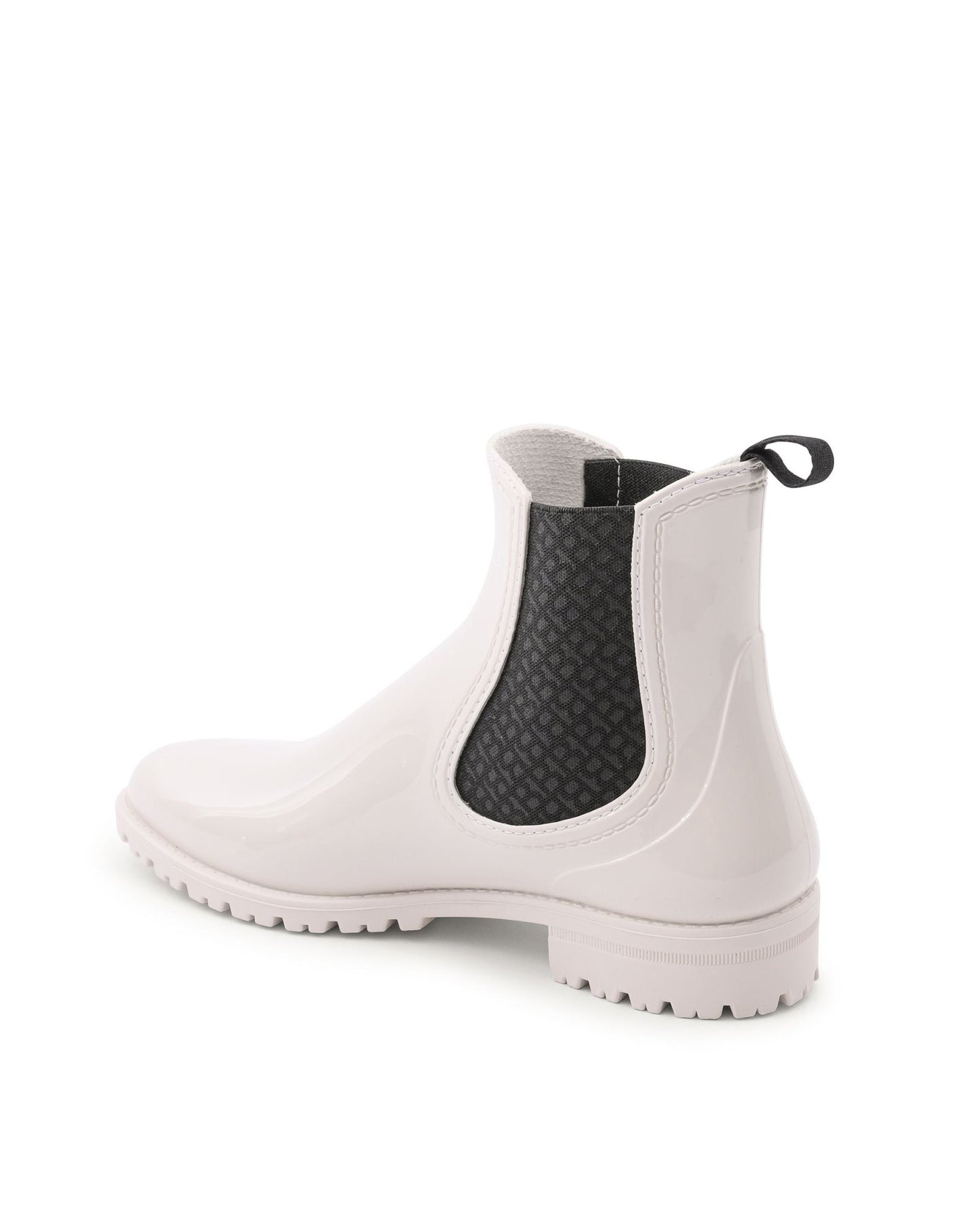 White Chelsea boot with black mesh panel on a white background