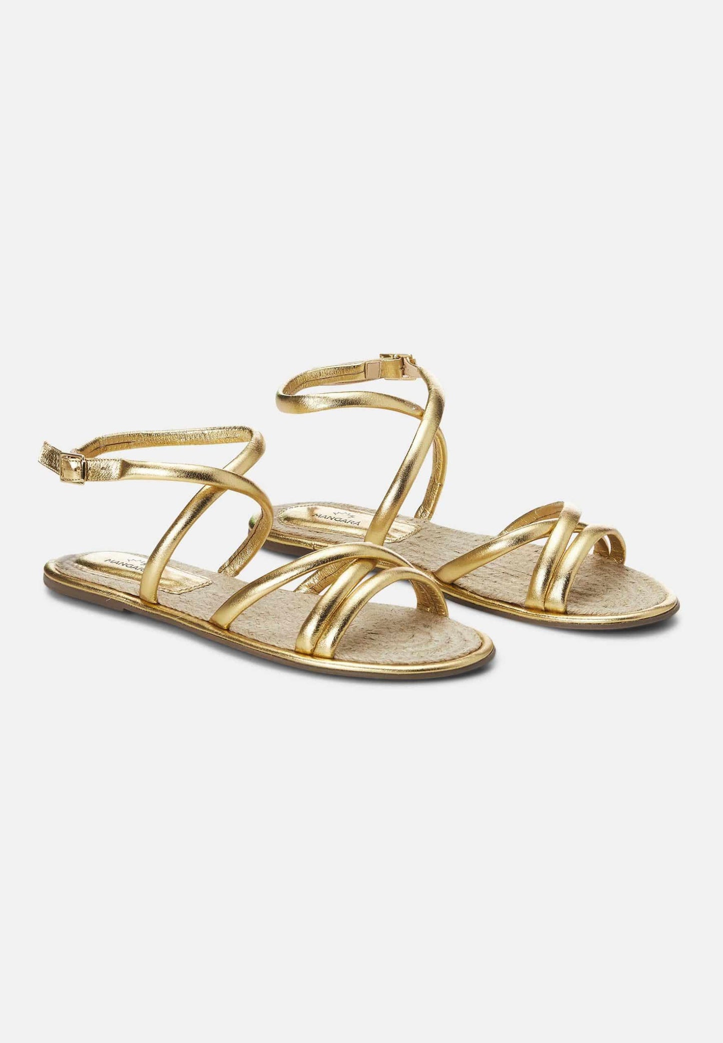 Pair of gold sandals on a white background