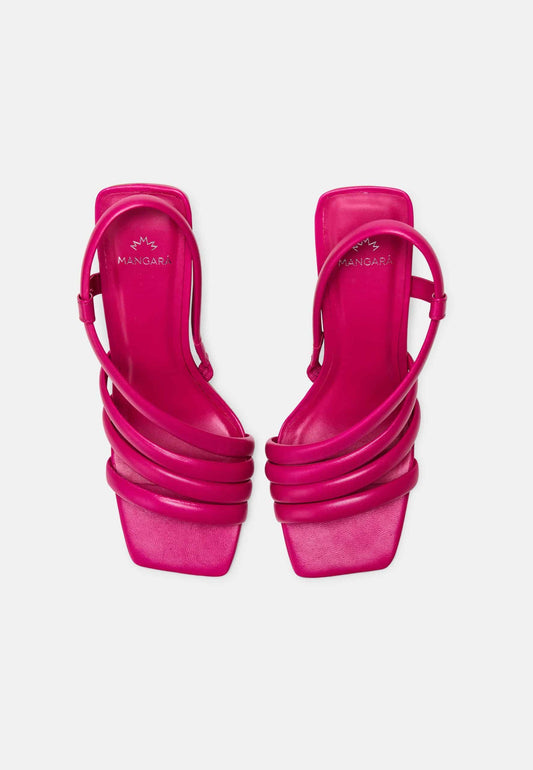 Pair of bright pink high-heeled sandals on a white background