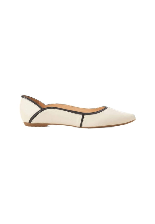 White flat shoe with brown accents on a white background