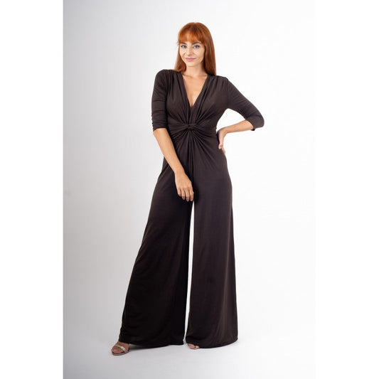 Woman wearing a brown jumpsuit on a white background