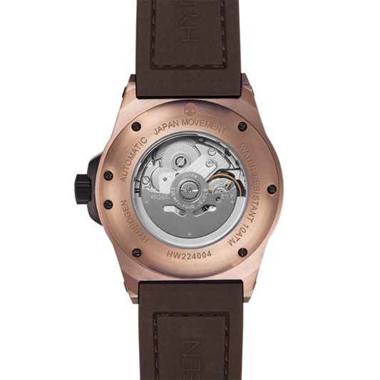 Watch with brown leather strap and visible mechanical components on a white background