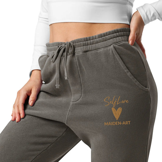 Gray sweatpants with 'Self Love Maiden Art' logo on a white background