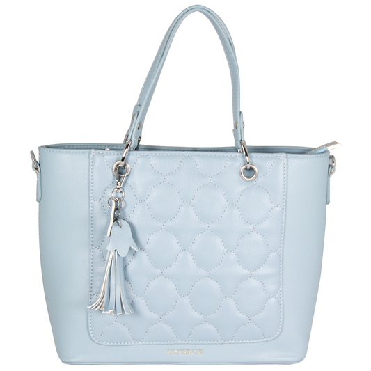 Light blue quilted handbag with a tassel on a white background