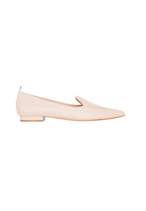 Nude-colored flat shoe on a white background
