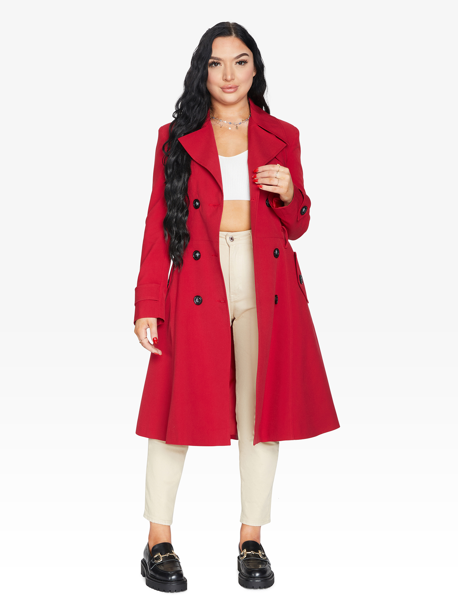 Woman wearing a red coat on a white background