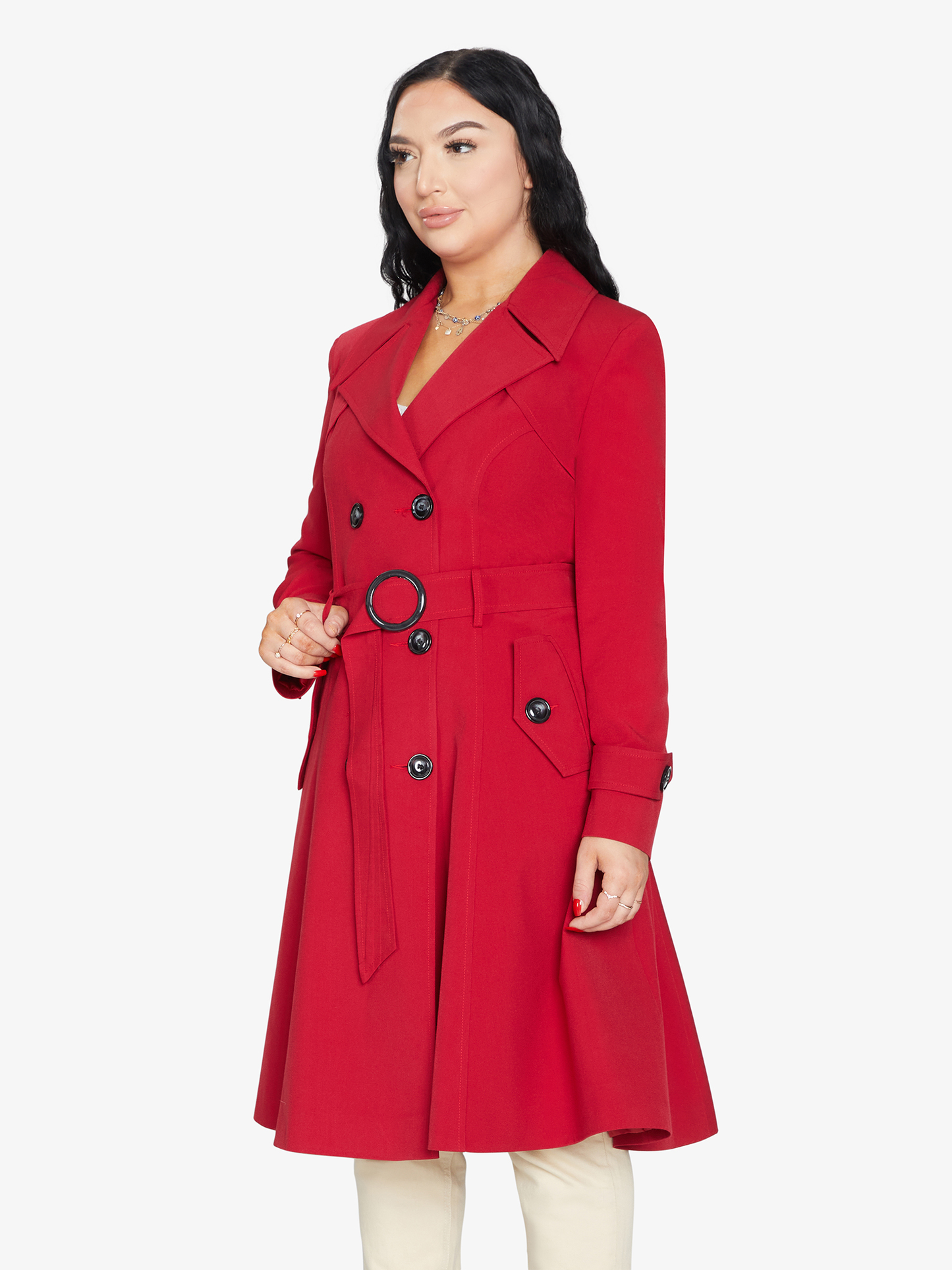 Woman wearing a red coat on a white background