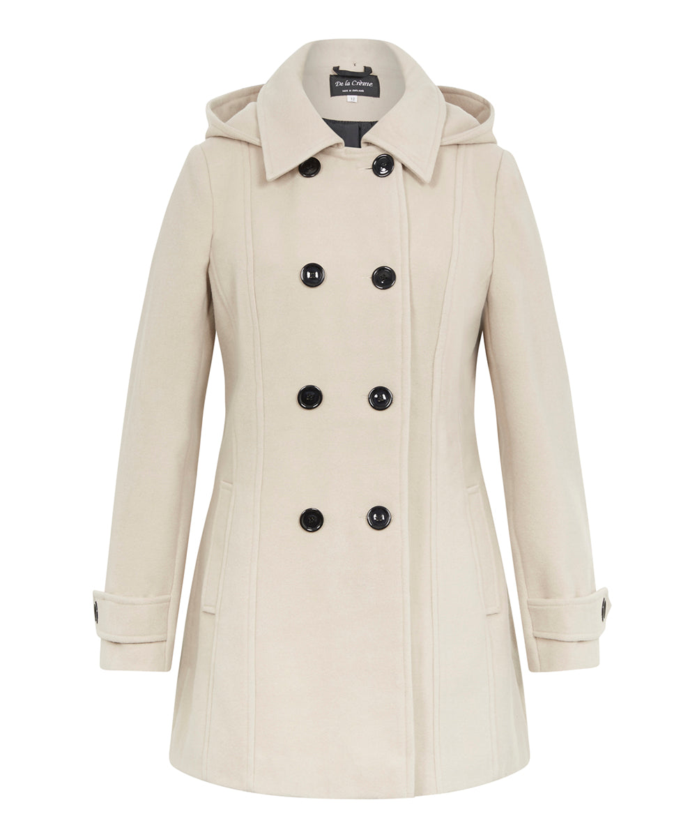 Beige coat with black buttons on a white background