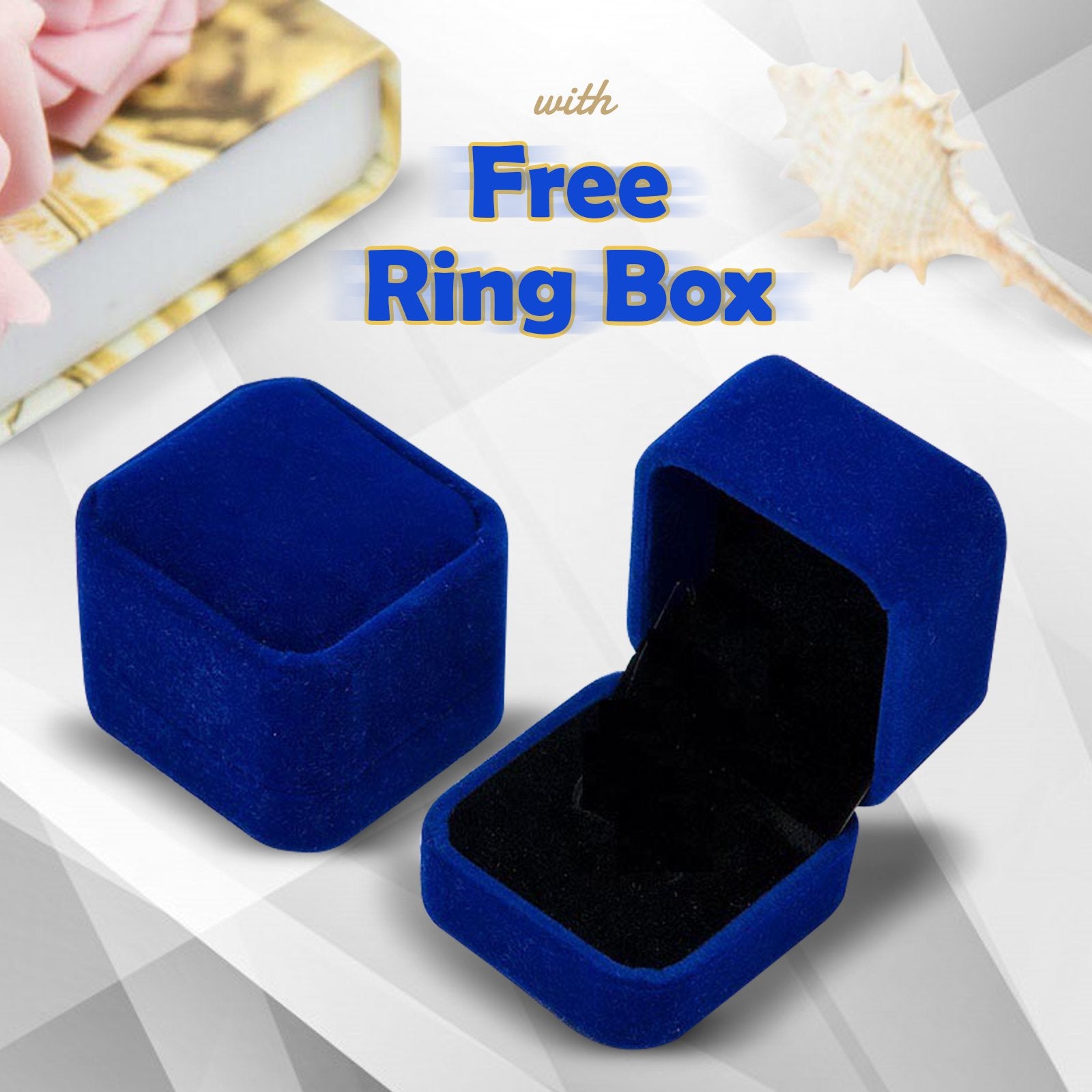 Blue velvet ring box with a free ring box offer on a white background
