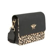 Black handbag with leopard print accents and a gold tag on a white background