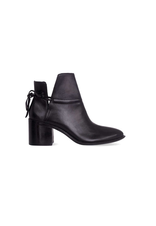 Black ankle boot with a block heel on a white background