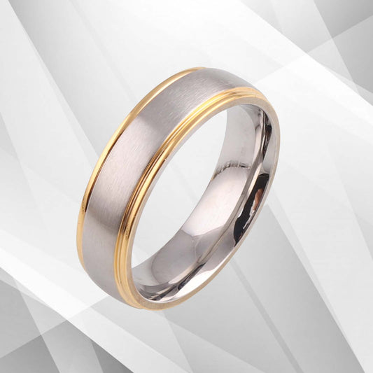 Two-tone ring with gold and silver finish on a light gray background