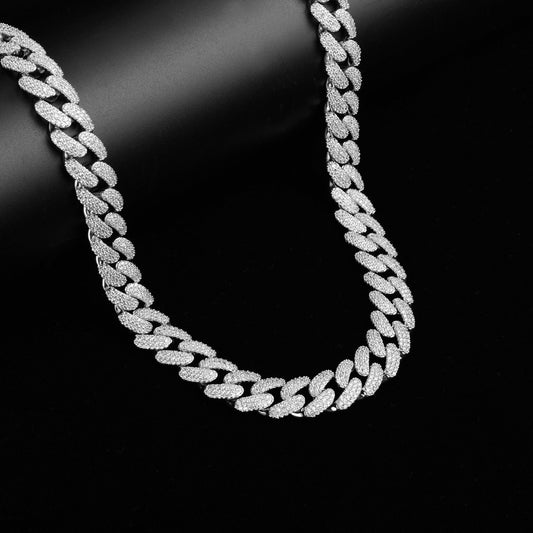 Silver chain necklace on a black background