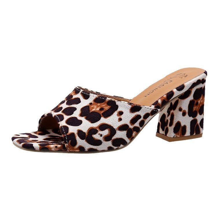 Leopard print sandal with a block heel on a white background