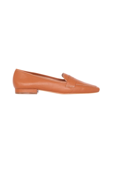 Single brown loafer shoe on a white background